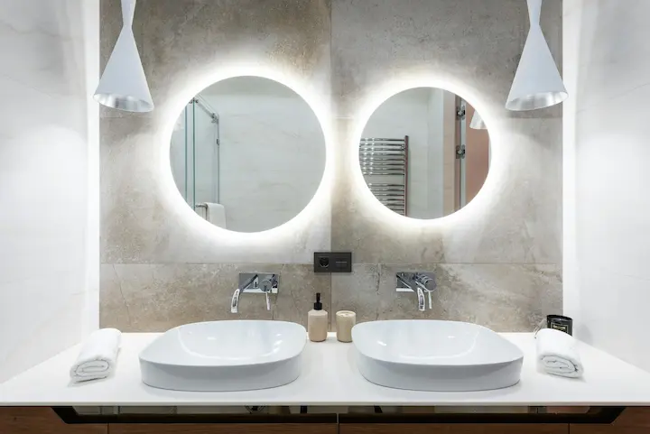 Minimalist bathroom with smart LED mirror and wooden vanity