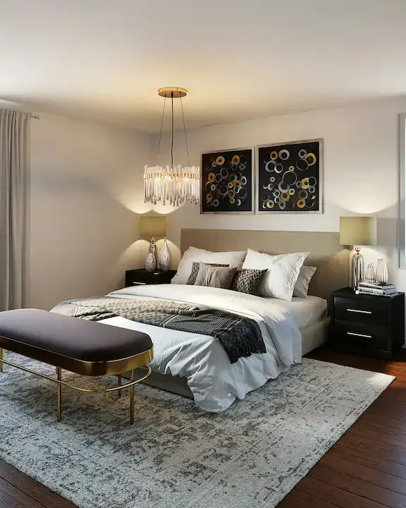 Modern bedroom with black and white bedding, soft lighting, and minimalist decor