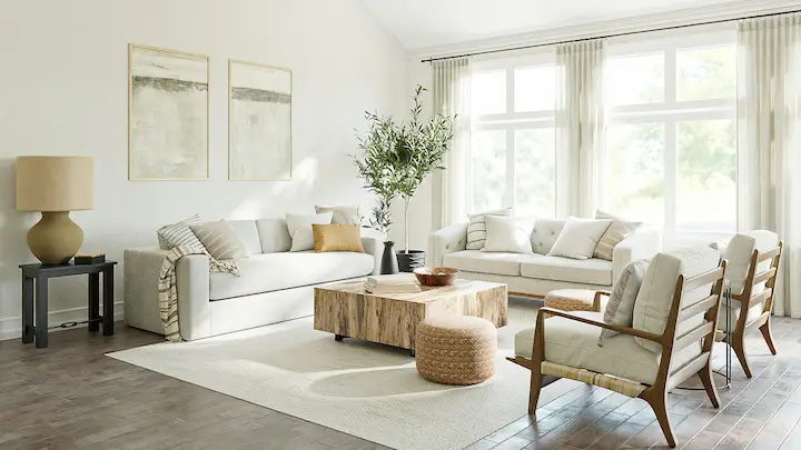 Minimalist living room with modular cream sofa, black side tables, and light neutral palette.