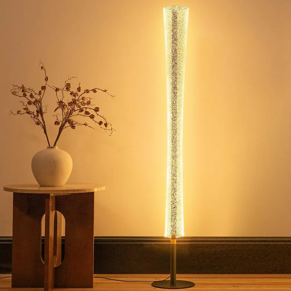 Tall slim sculptural floor lamp with arc design in minimalist Japandi living room