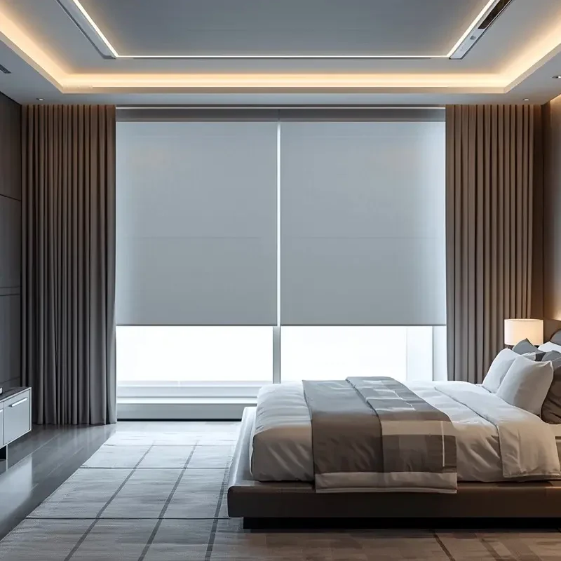 Modern bedroom with motorized roller shades and flanking curtain panels