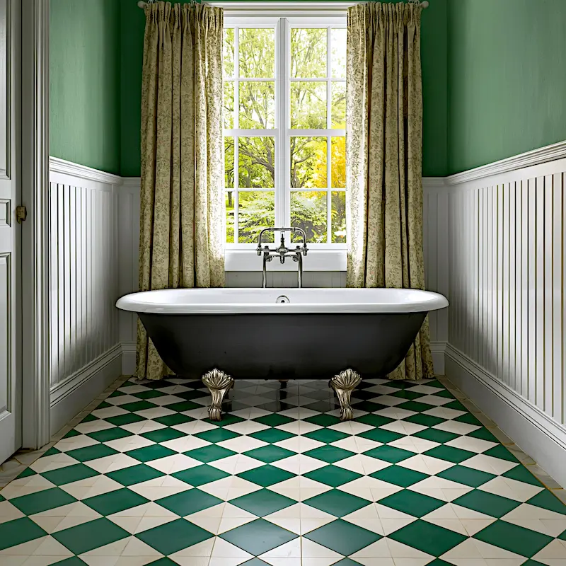green and white checker tile vintage bathroom with claw-foot tub 2026