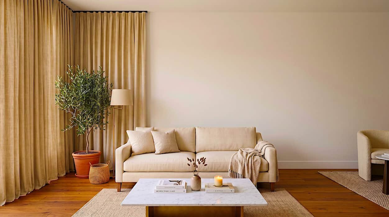 empty wall above sofa with no artwork beginner mistake