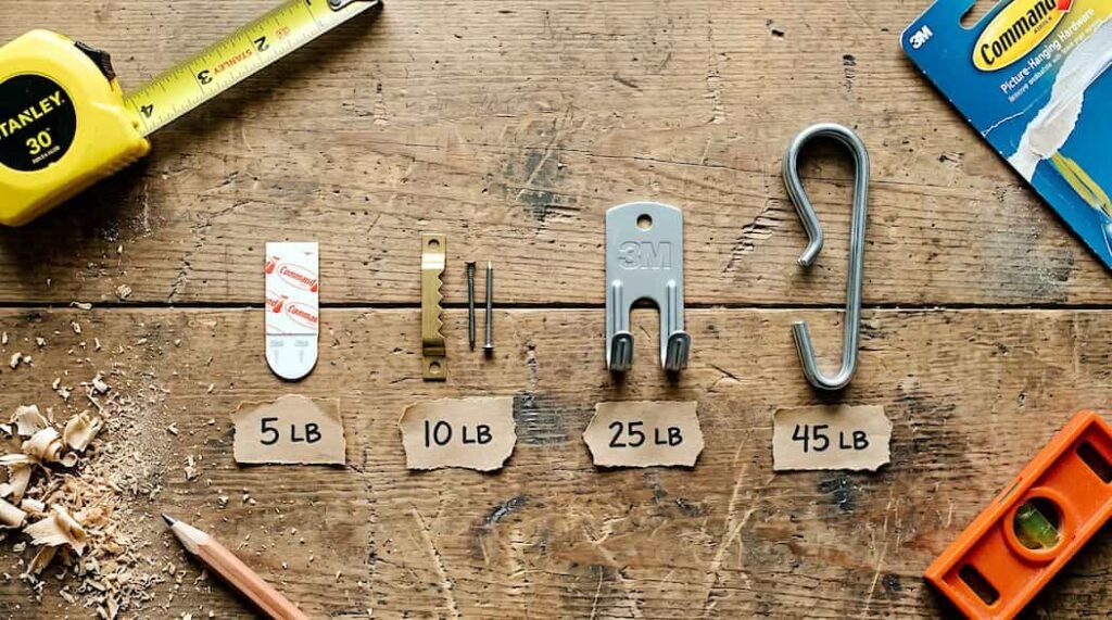 Picture hanging hardware compared by weight rating from 5 to 45 pounds